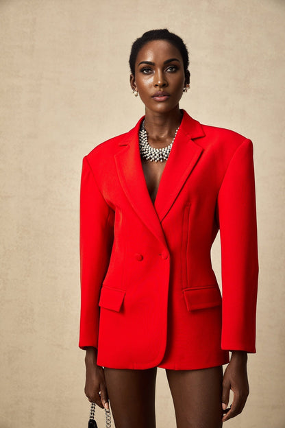 A red hourglass shaped double breasted blazer with a fitted waist and flared hem creating an hourglass silhouette