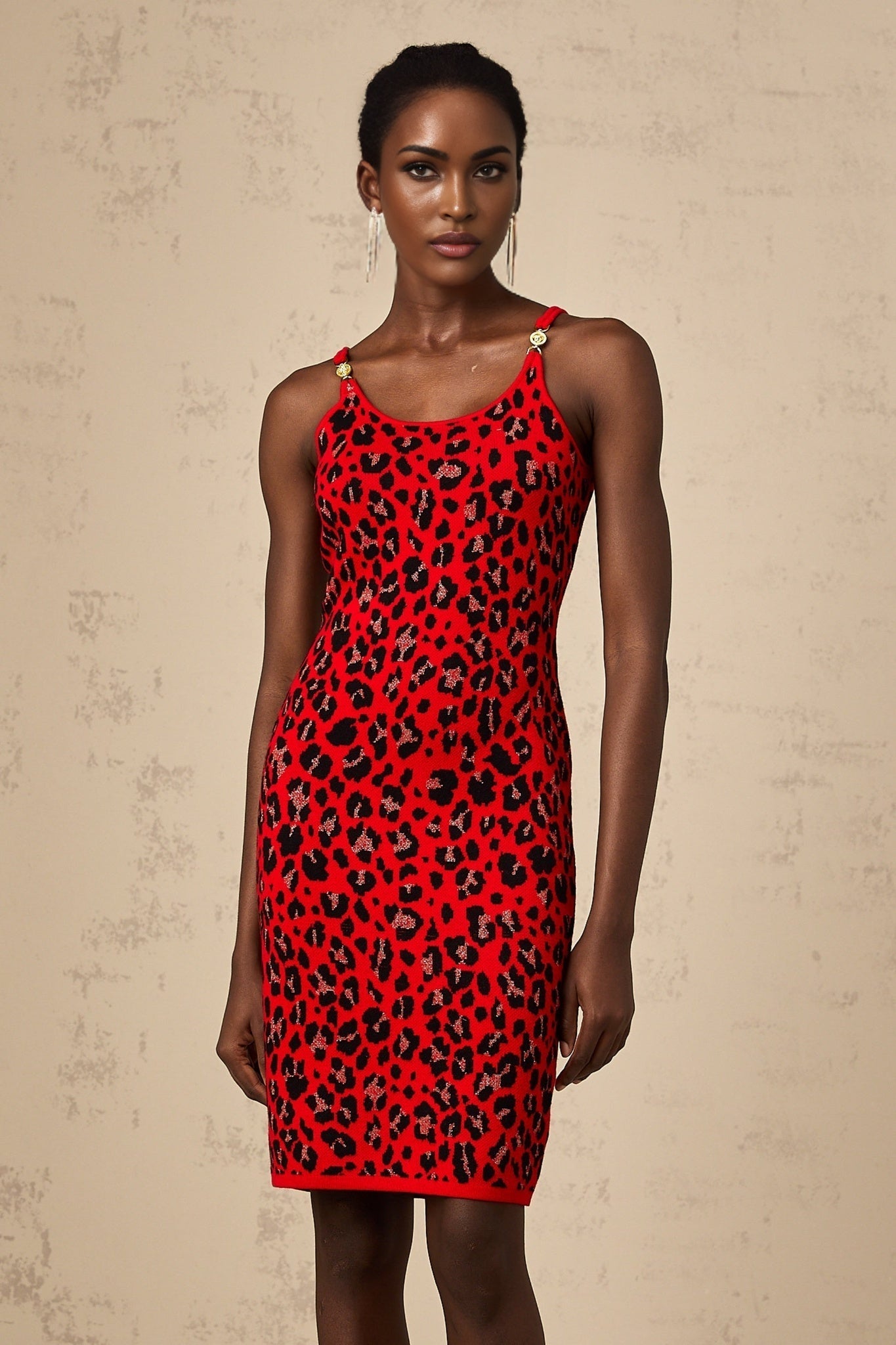 A short red mini dress with a shiny leopard print pattern and lurex fabric
