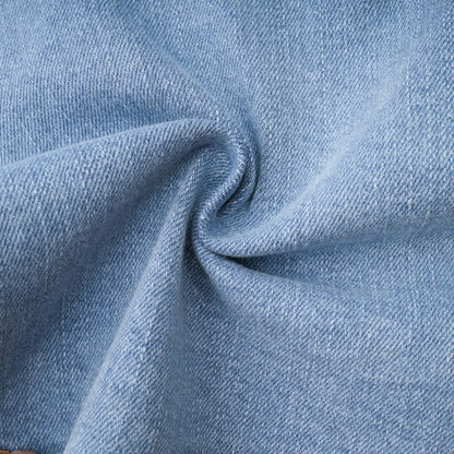 A denim skirt with a ruffled hem named Capucine featuring a volant style edge