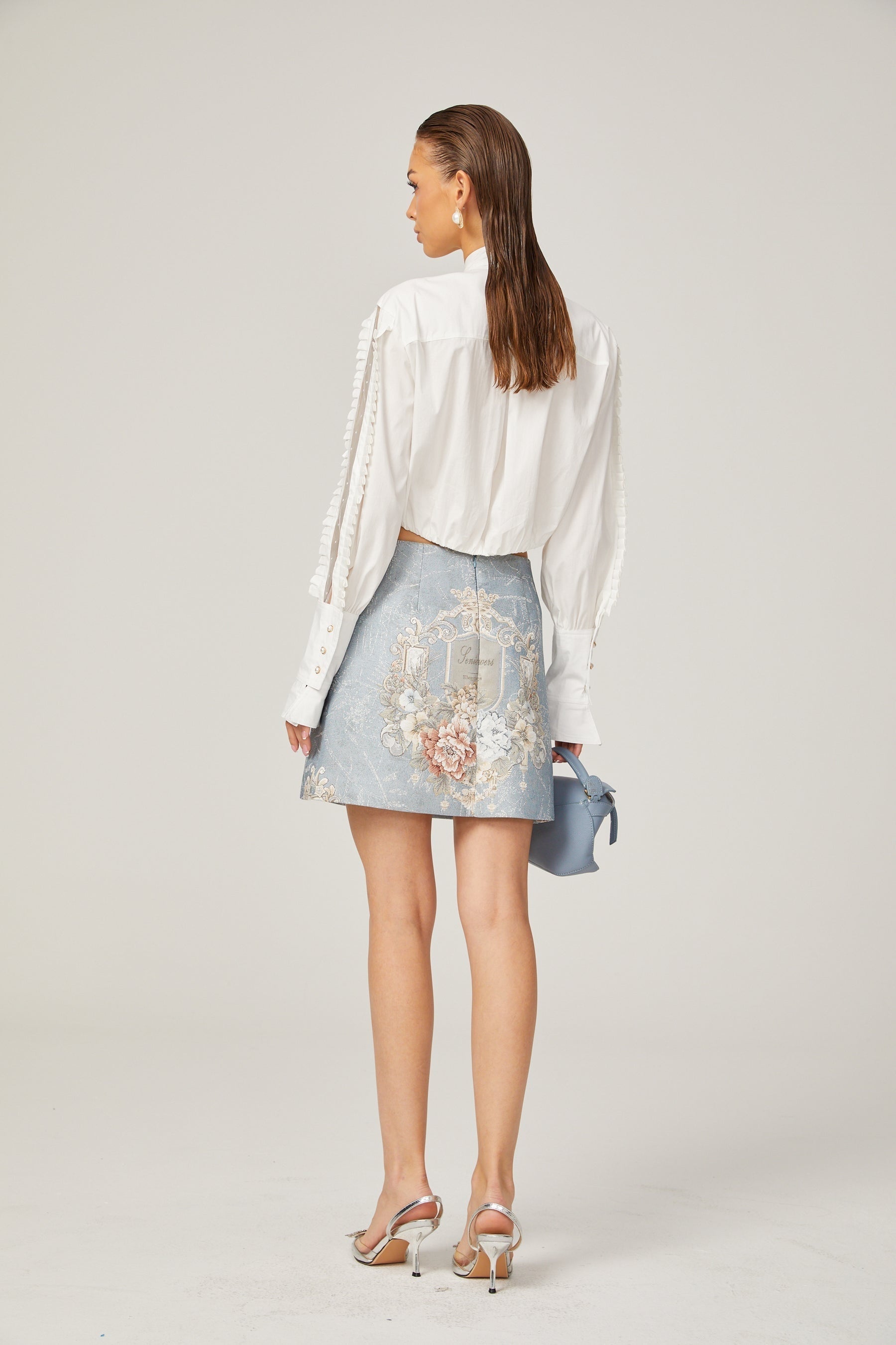 Céleste white pleated scarfcollar shirt