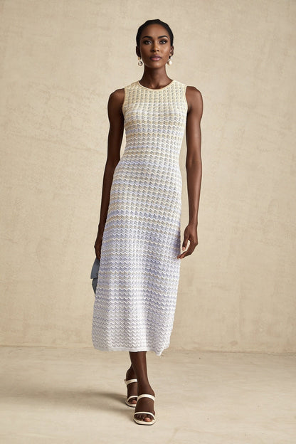 Woman wearing a ribbed knit midi dress with contrasting color details and a formfitting silhouette