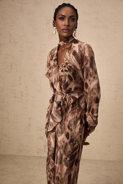 A brown midi dress with a leopard print pattern and ruffled details featuring a feminine silhouette and a flowy design