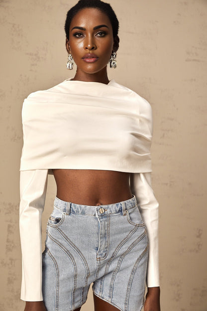 Woman wearing white sleeveless ruched crop top with gathered fabric detail