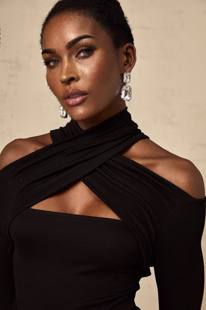 A black sleeveless top with ruched detailing made from stretchy jersey fabric