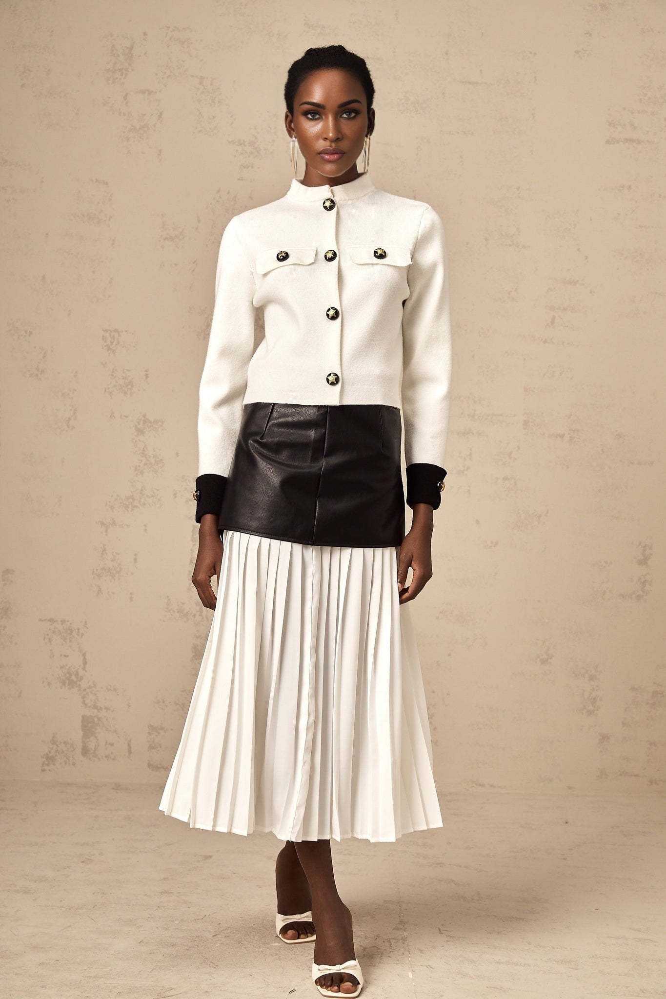A white knitted jacket with contrasting color details named Cyrielle