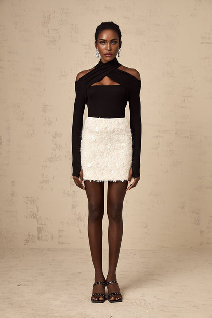 White sequined mini skirt with shimmering texture and short length