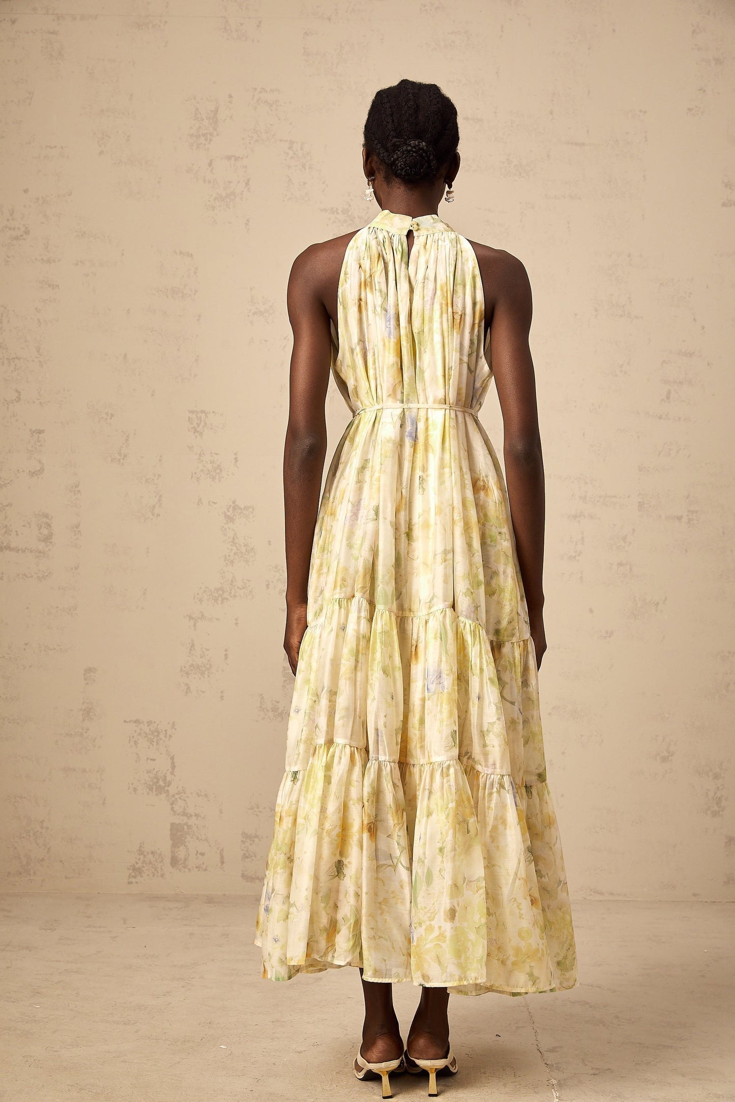 Sleeveless yellow midi dress with floral print pattern called Ulani