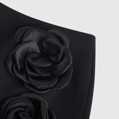 Black mini skirt with artificial flowers by Nalini