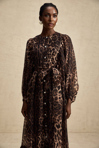 A leopard print midi dress with a single breasted design featuring the Gisele style