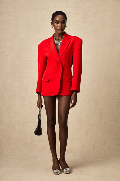 A red blazer with an hourglass silhouette and doublebreasted front closure