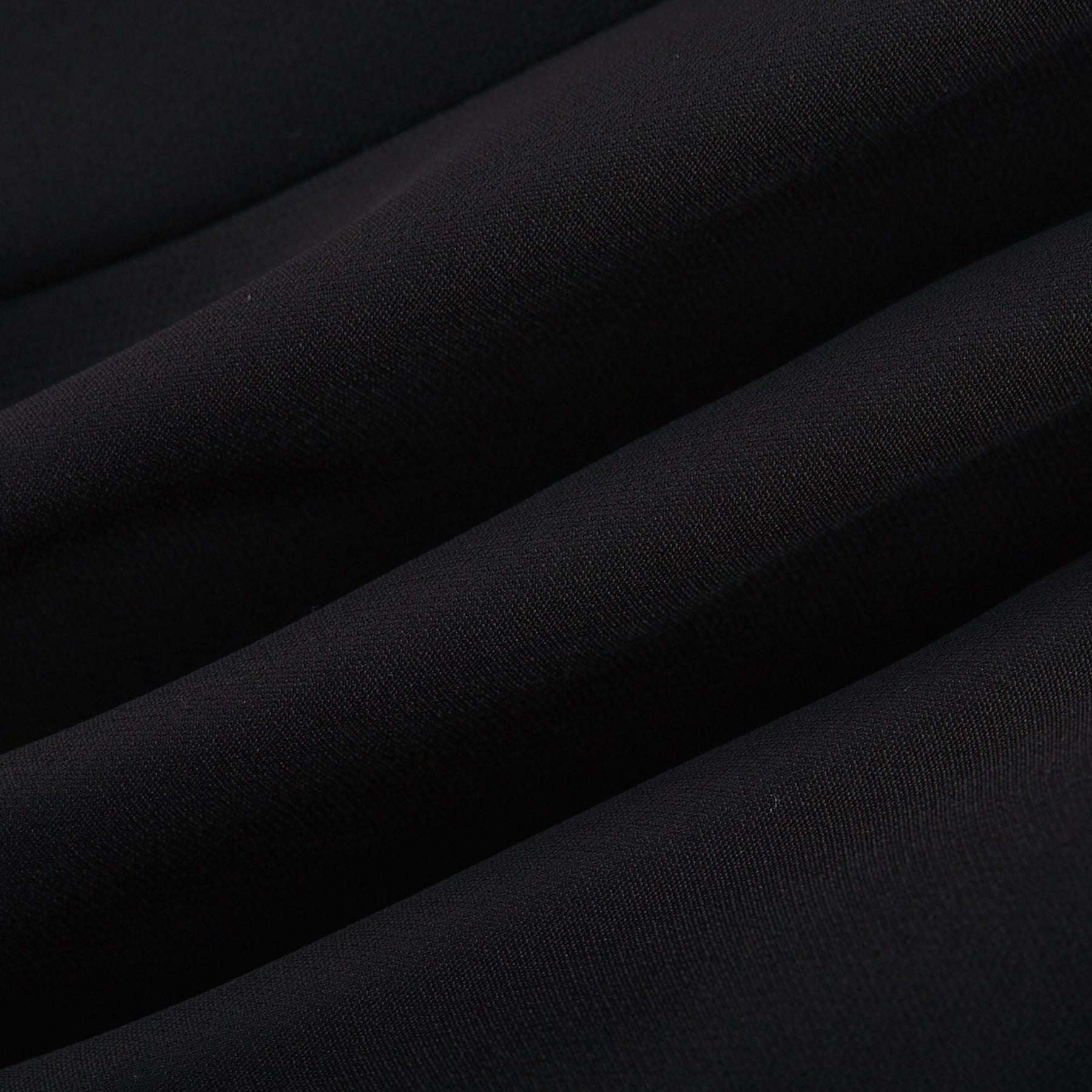 Black mini skirt with artificial flowers by Nalini