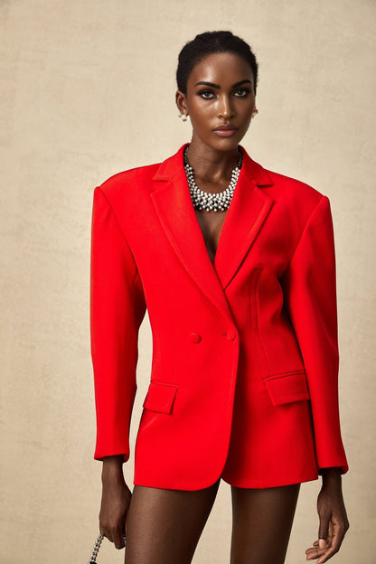 A red blazer with hourglass silhouette and doublebreasted design