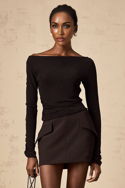 Woman wearing black sequined matching set with top and skirt Berenice design