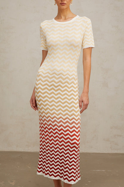 A yellow knit midi dress with a zigzag pattern featuring Isabelle design worn by a model against a plain background