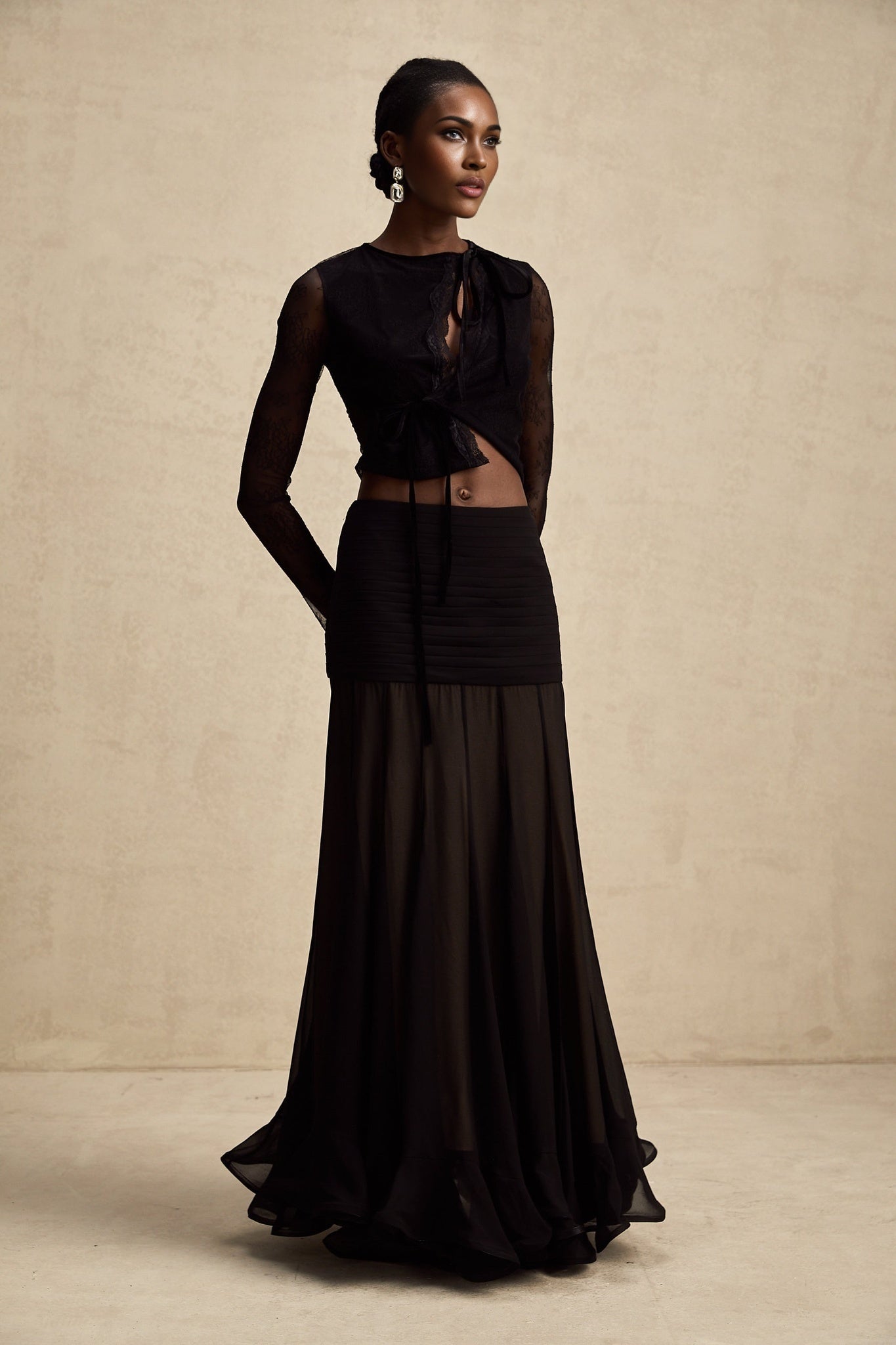 Black cropped top with sheer lace trim and see through details