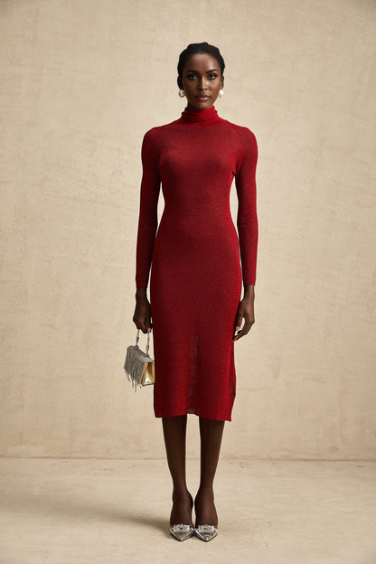 Woman wearing a red metallic midi dress with pointelle detailing standing in a neutral background