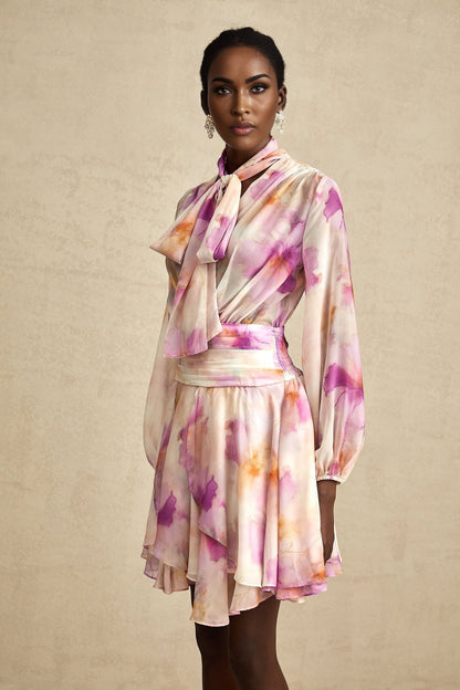 A floral print mini dress with a Vneck design featuring the Maelys brand