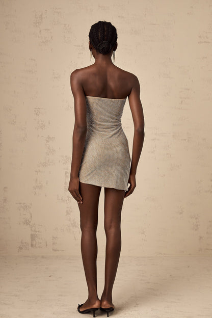 A short glittering mini dress with rhinestone embellishments and strategic cut out details named Penelope