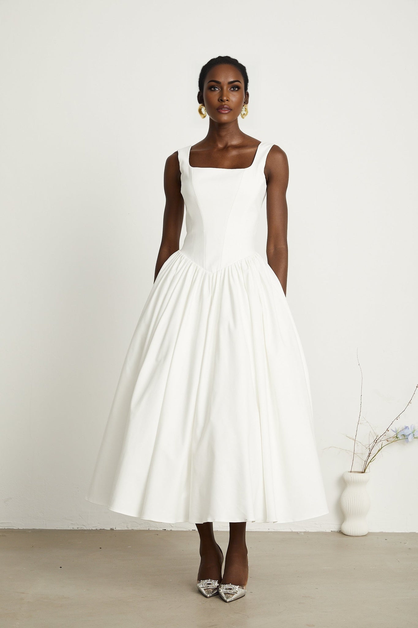White pleated corset dress named Sadie