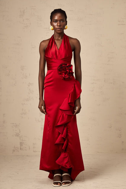 A red halterneck maxi dress with 3D petal ruffles and a long flowing skirt