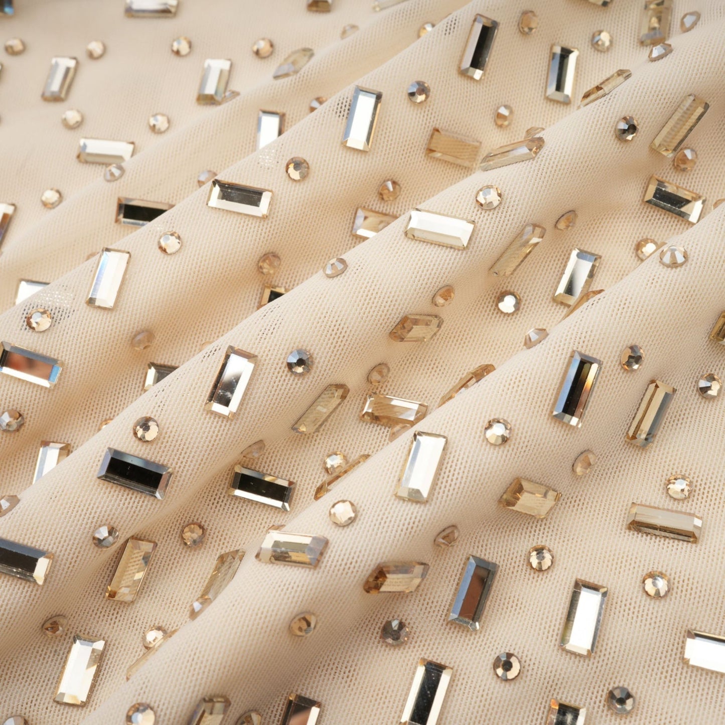 A short draped mini dress with crystal embellishments designed by Noemie