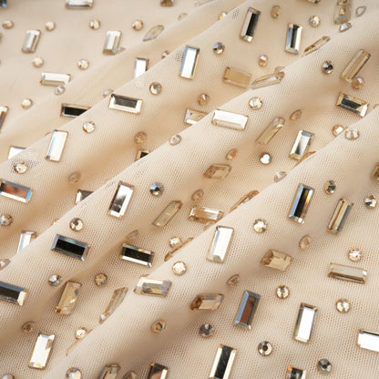 A short draped mini dress with crystal embellishments designed by Noemie