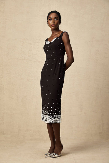 A black midi dress with faux pearl embellishments named Apolline
