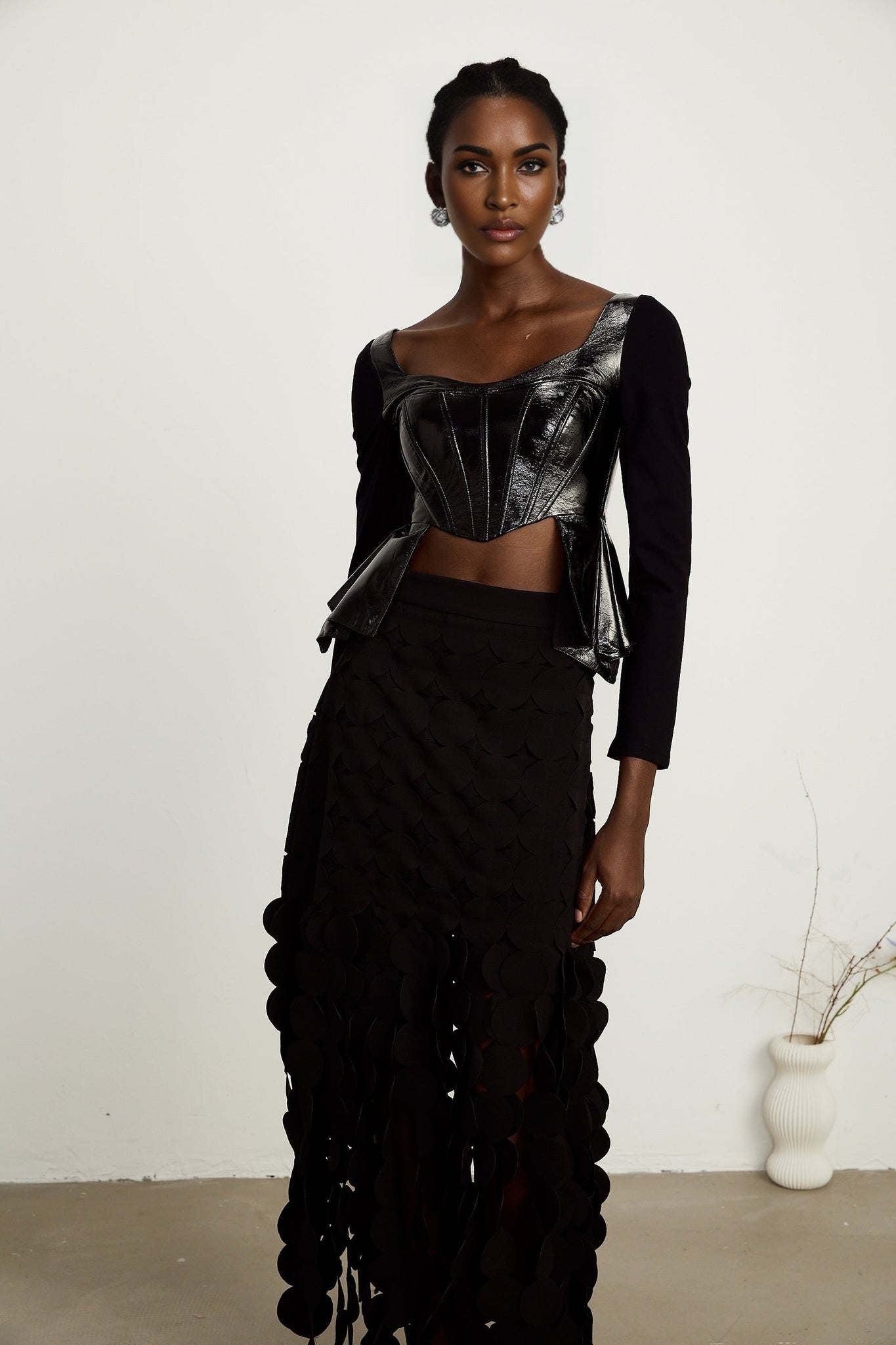 Jeannette fauxleather peplum panelled top