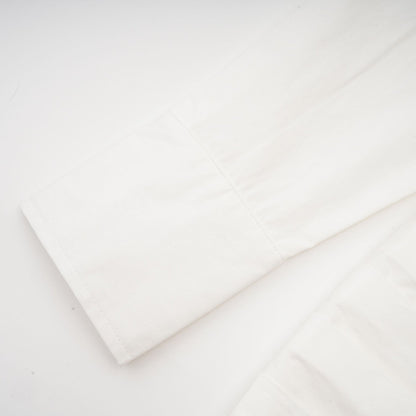 Alt text White pleated mini shirt dress with fitted waist by Orlane