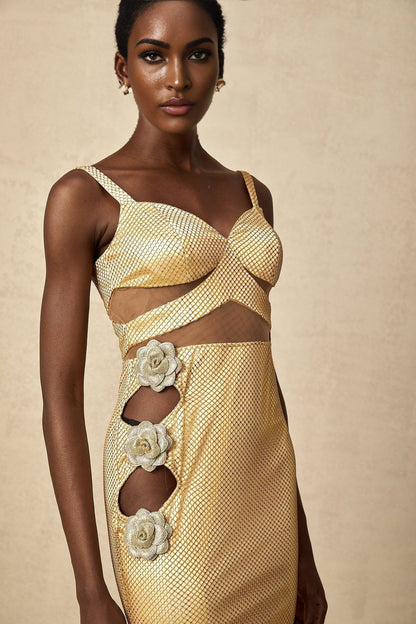 A long gold maxi dress with floral cutout details and a sleek silhouette suitable for formal occasions