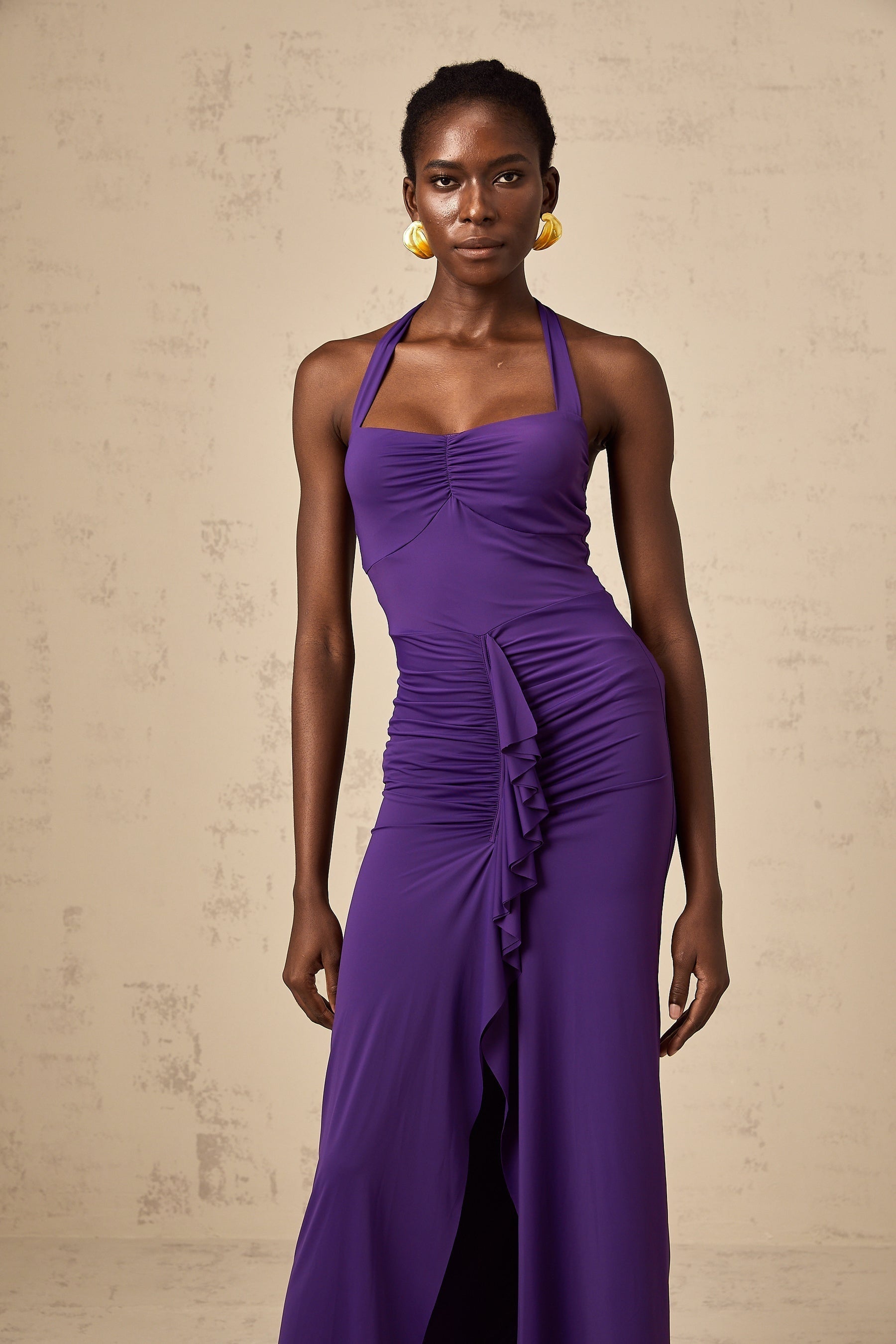 A purple halterneck midi dress with ruched detailing named Renata