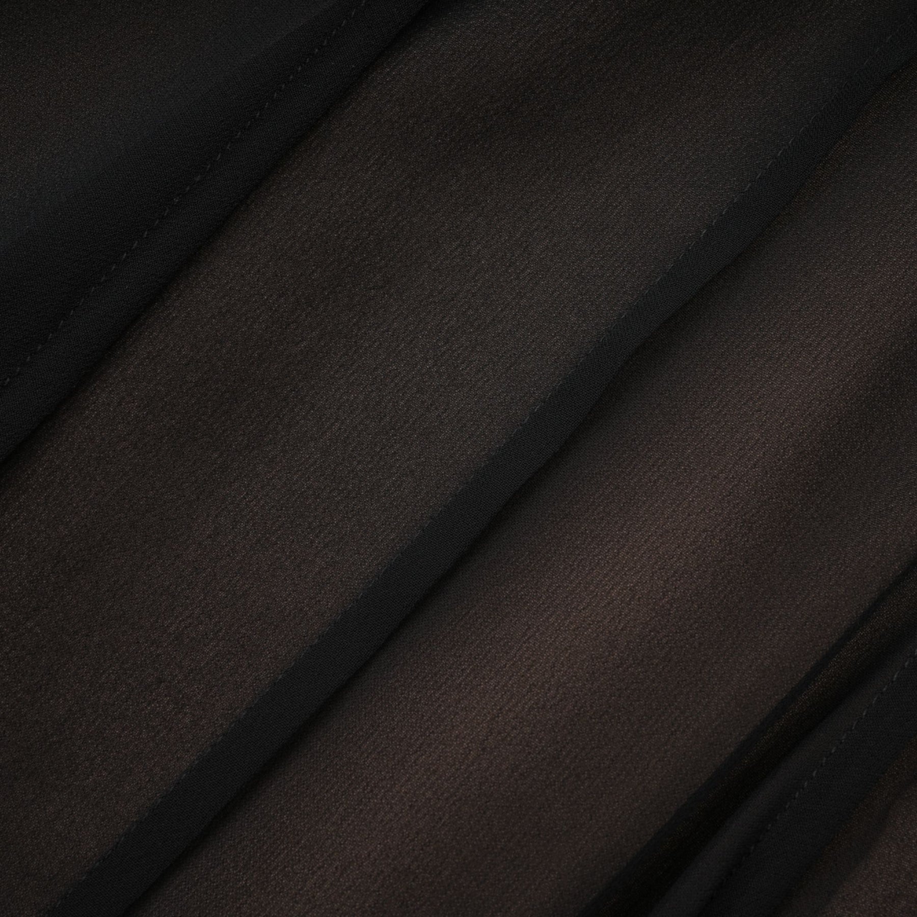 A long flowy maxi skirt with ruffles and pleats made of rayon and tulle fabric in a Jacqueline style