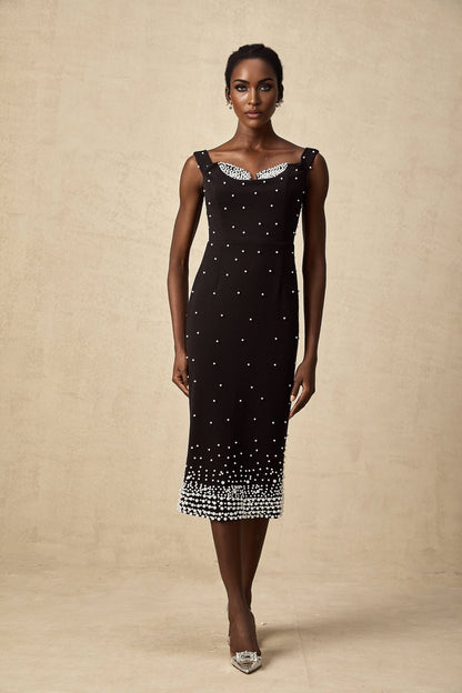 A black midi dress with faux pearl embellishments called Apolline