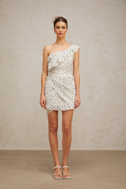 A short white mini dress with a pattern print and ruffled details named Irina