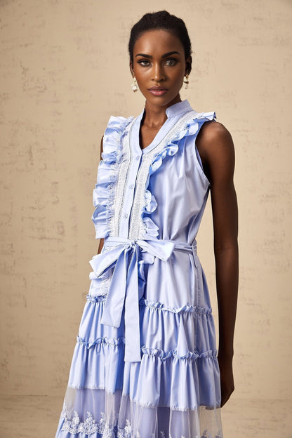 A blue midi dress with ruffles and floral lace trim featuring a tiered skirt design named Olena
