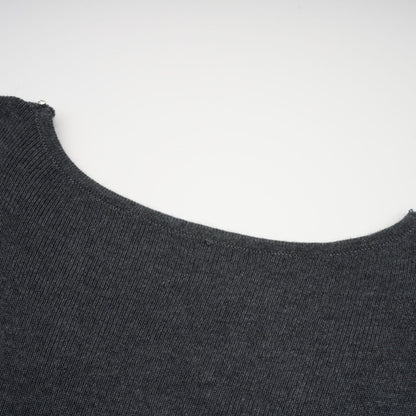 A grey cardigan with sequined butterfly designs adorning the fabric