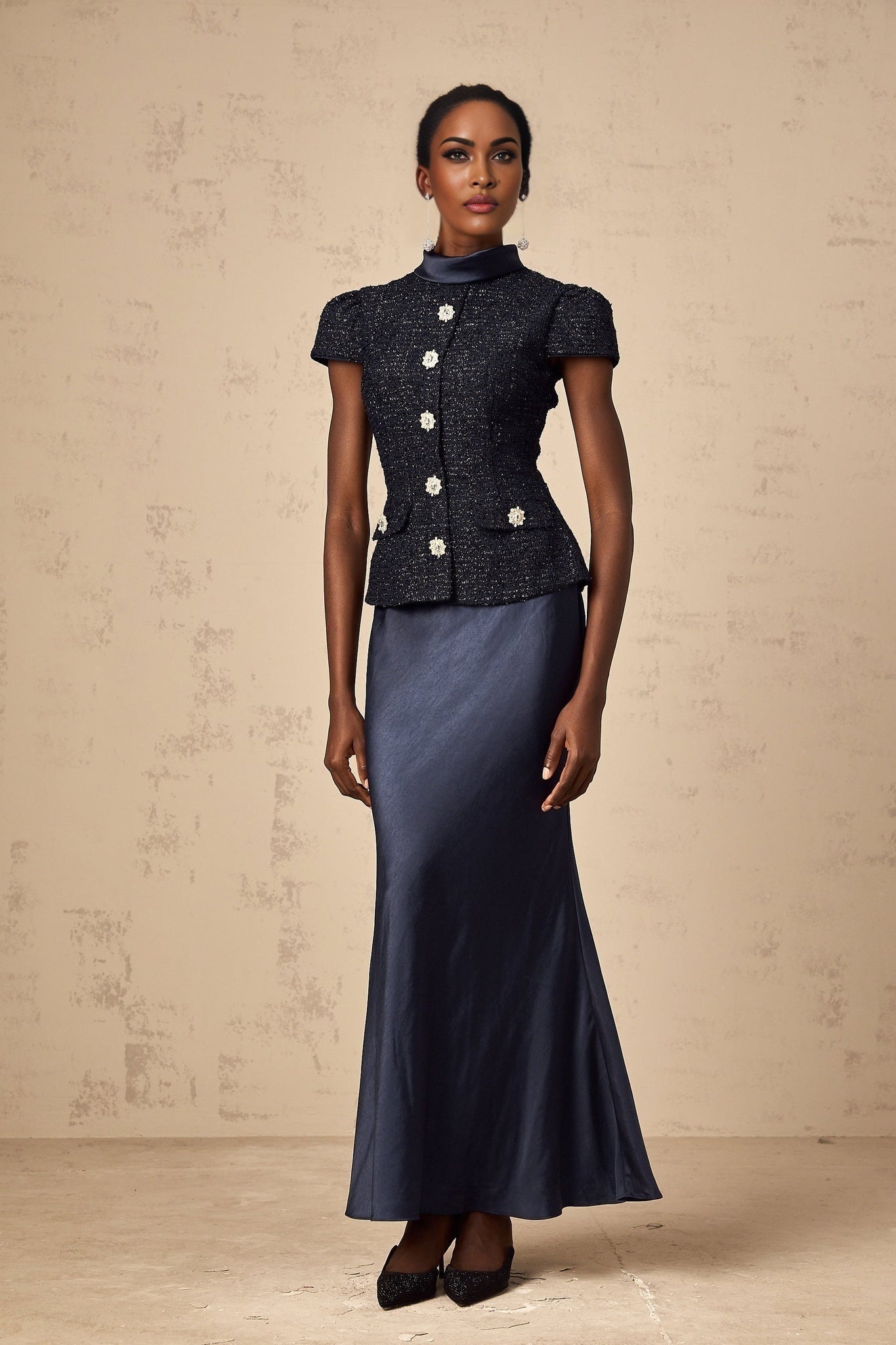 A long blue maxi dress with a peplum waist and panelled design featuring the Josette style