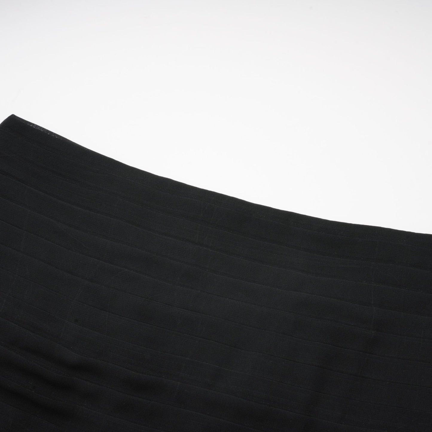 A long flowing maxi skirt with ruffles and pleats made of rayon and tulle fabric in a Jacqueline style