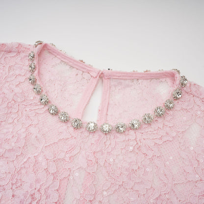 A pink midi dress with floral embroidery and lace detailing featuring embellishments and a feminine silhouette