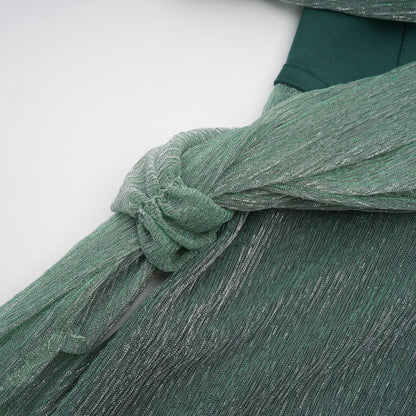 A green maxi dress featuring a corset bodice with ribbon design details and a long flowing skirt