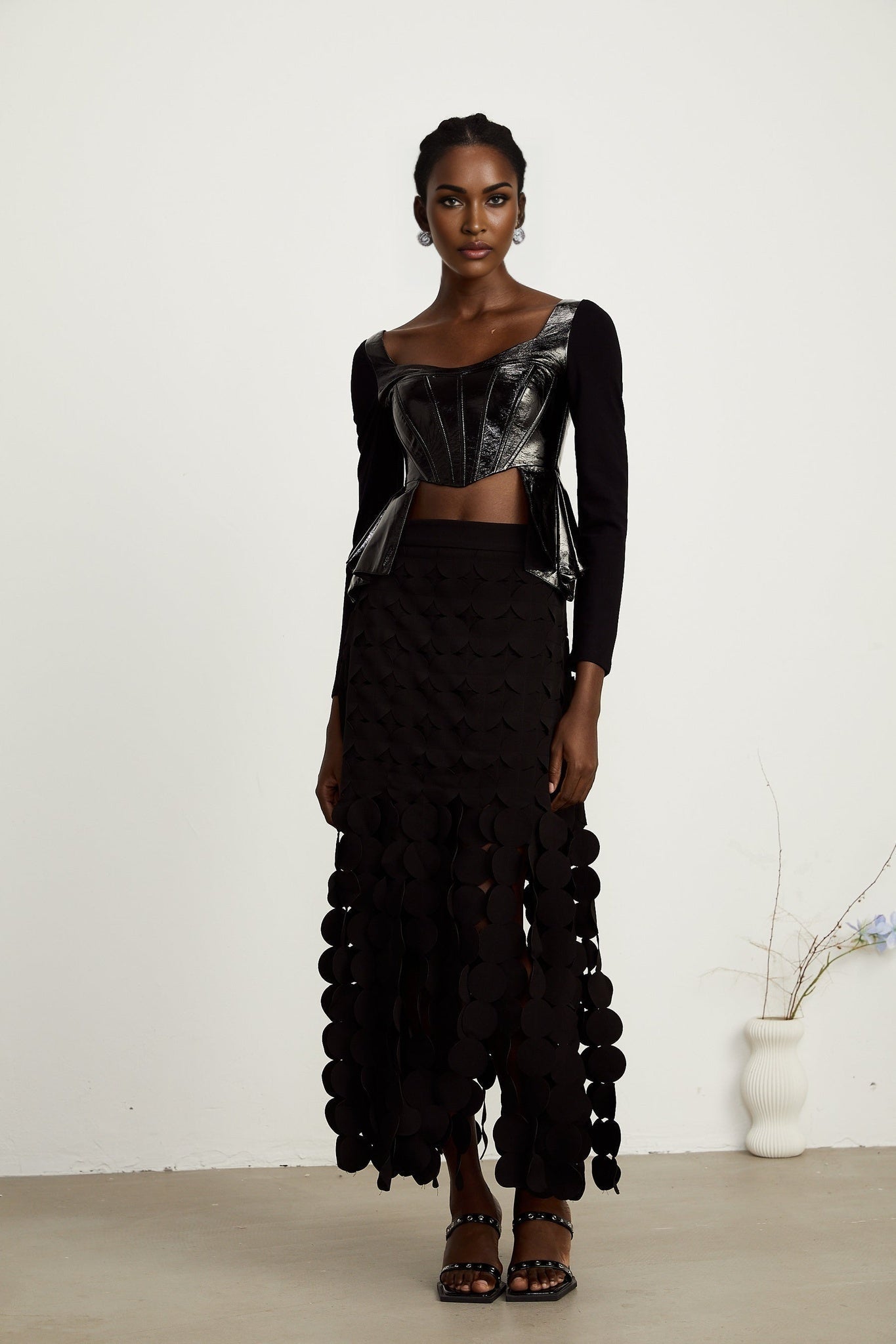 Jeannette fauxleather peplum panelled top