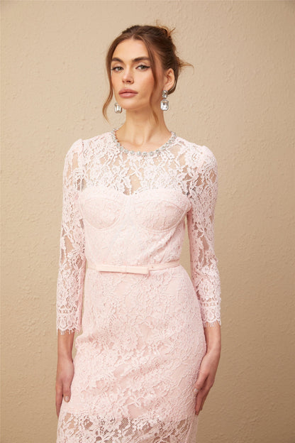 A pink midi dress with floral embroidery and lace details featuring embellishments and a delicate feminine design