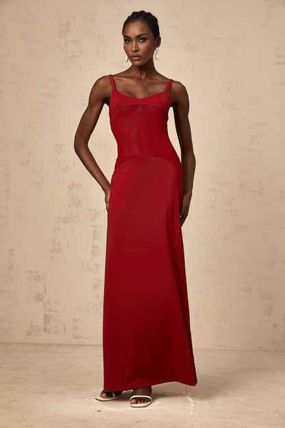 A long red maxi dress with sheer tulle panels by Celine