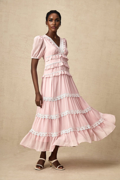 A pink midi dress with ruffled tiers and a feminine silhouette named Amelie