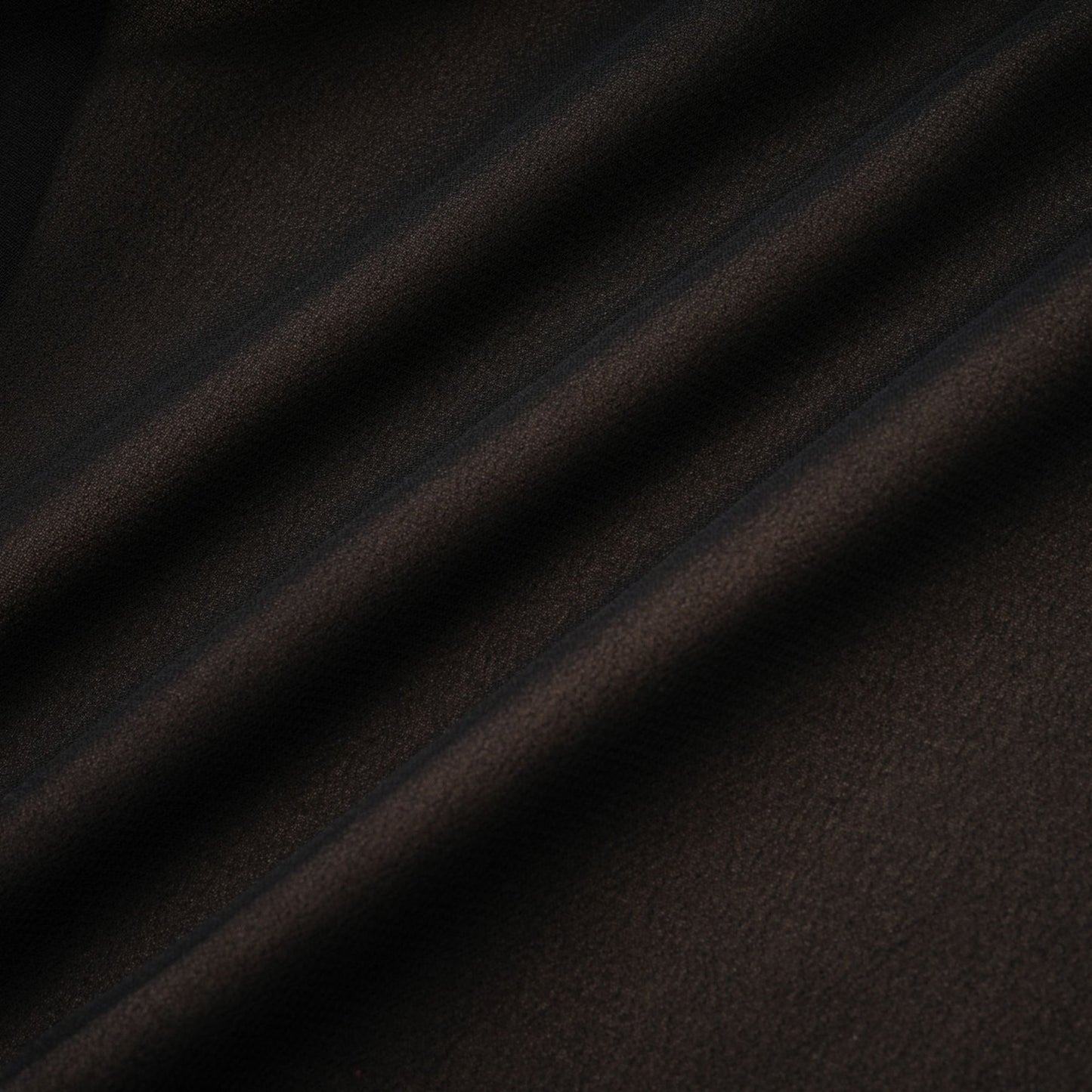 A long flowy maxi skirt with ruffle details and pleated tulle fabric in a soft rayon material