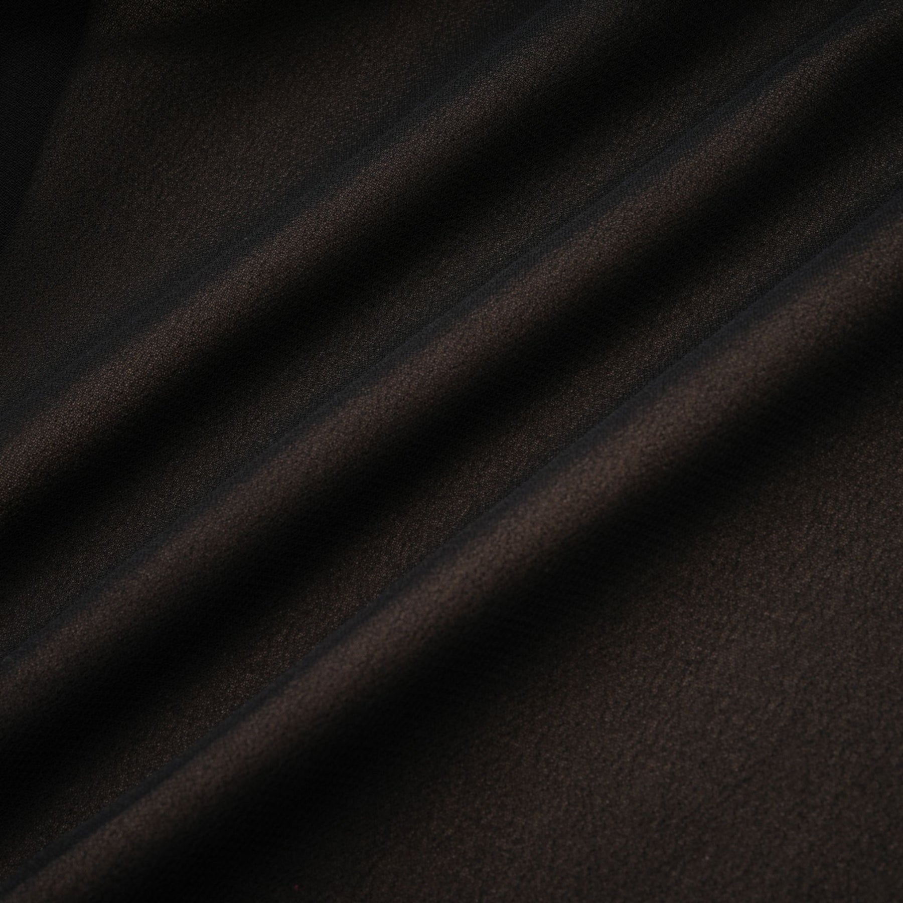 A long flowy maxi skirt with ruffle details and pleated tulle fabric in a soft rayon material