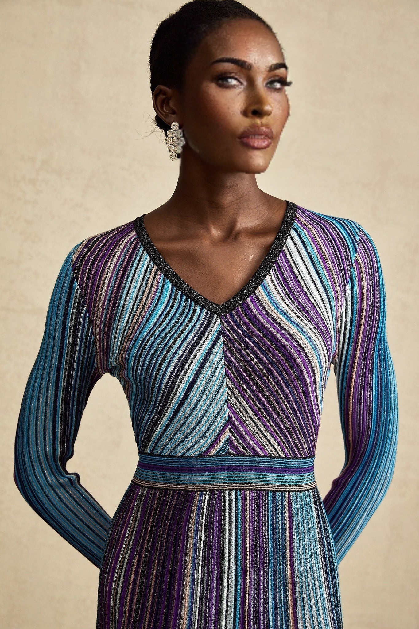 A blue metallic midi dress with pleated details and a shimmering finish named Mathilde