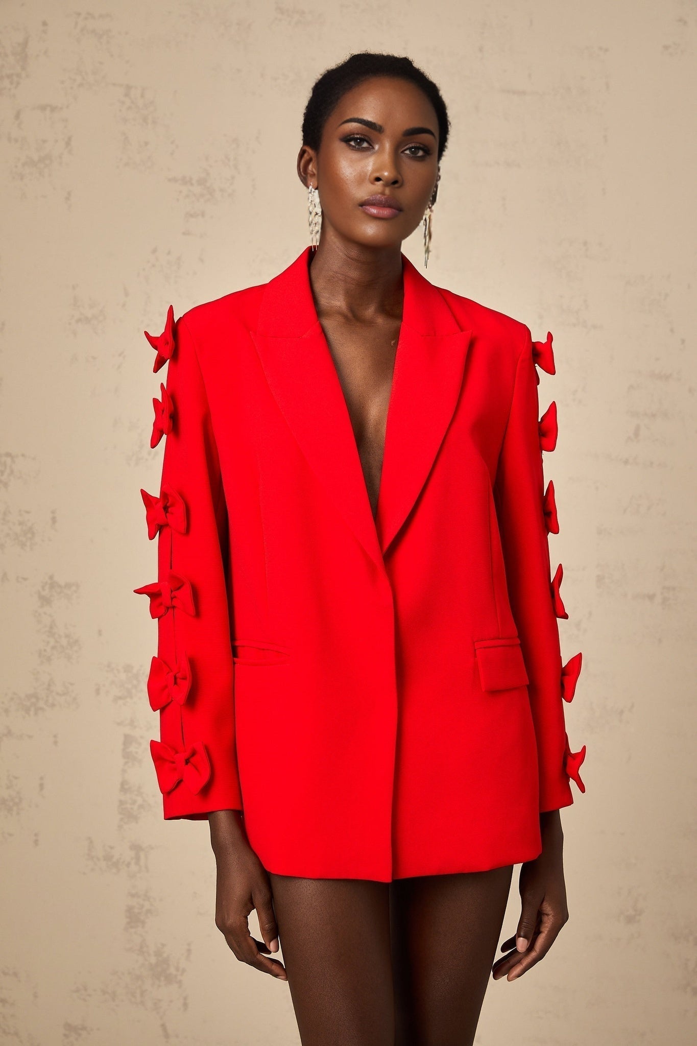 Stylish red blazer with bowknot detail and cutout design