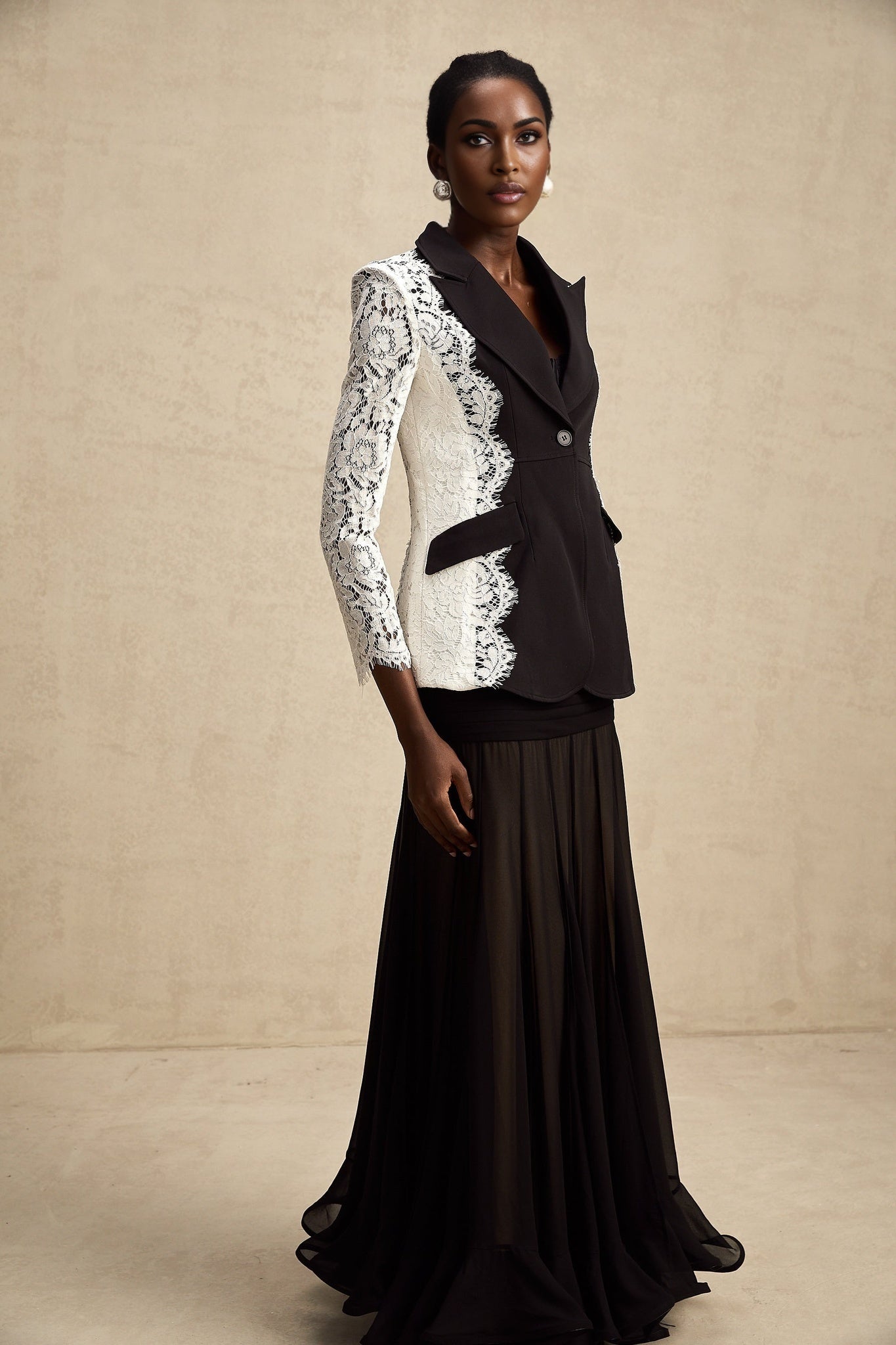 A womens blazer featuring color block design and lace trim named Sandrine