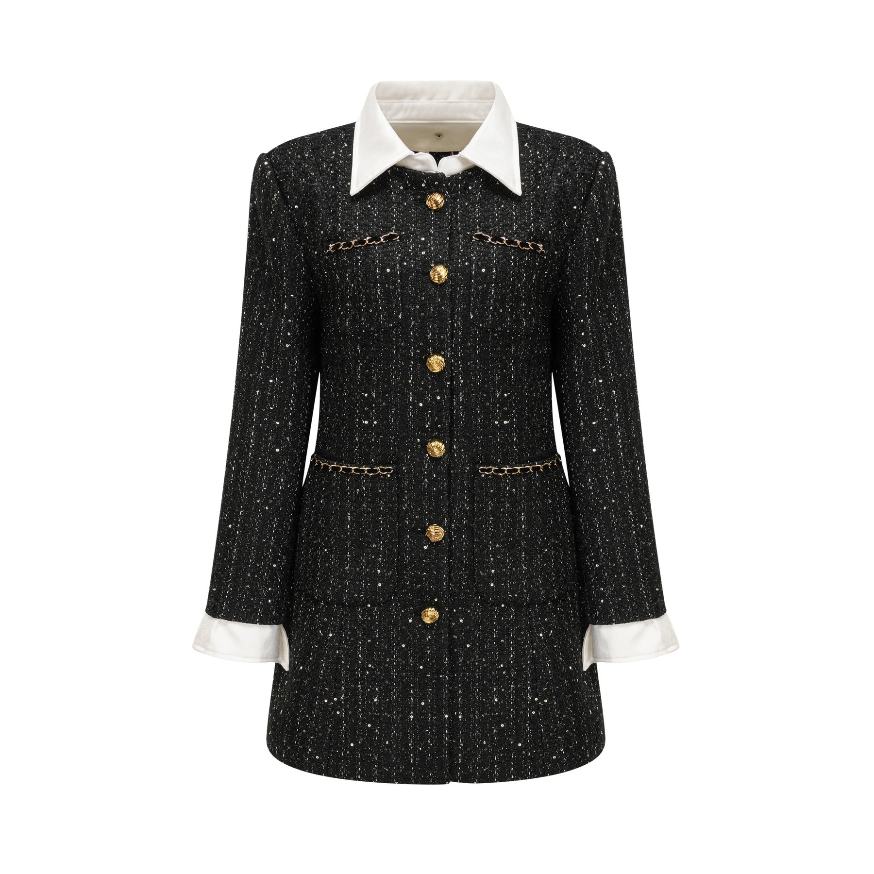 Woman wearing a black mini dress with sequin panels and tweed fabric featuring a sleeveless design and round neckline